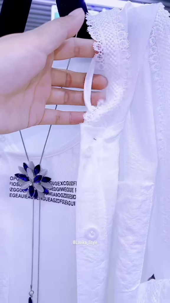 Elegant White Layered Outfit with Striking Blue Necklace - Photo 2